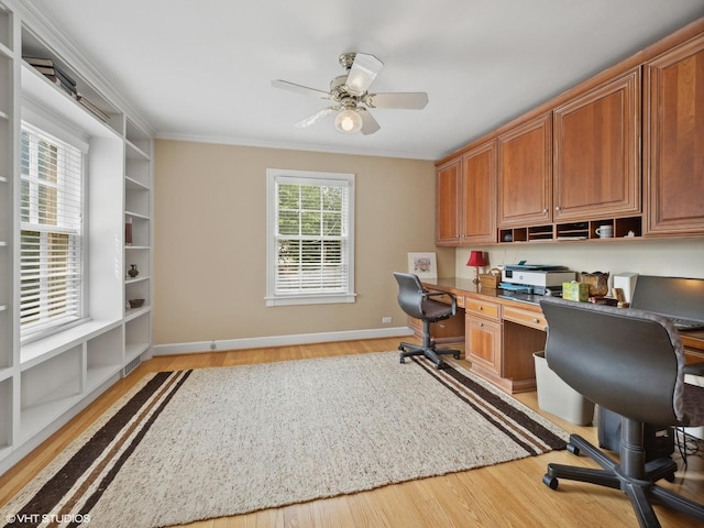 office area with crown molding, ceiling fan, and light wood-type flooring