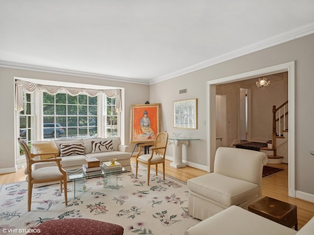 living area with hardwood / wood-style flooring and crown molding