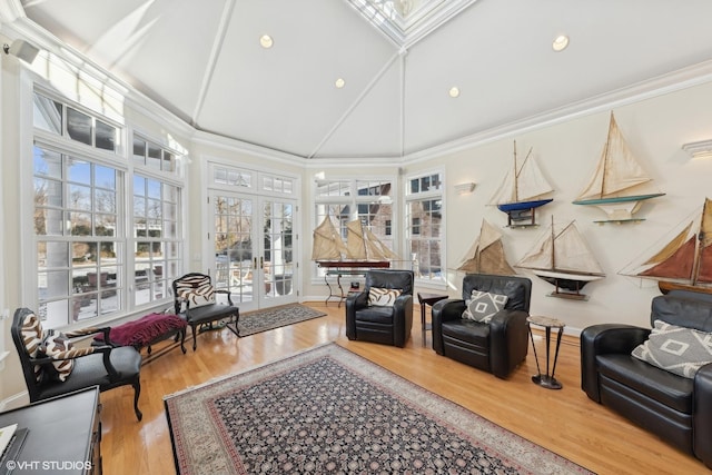 sunroom / solarium featuring french doors and vaulted ceiling