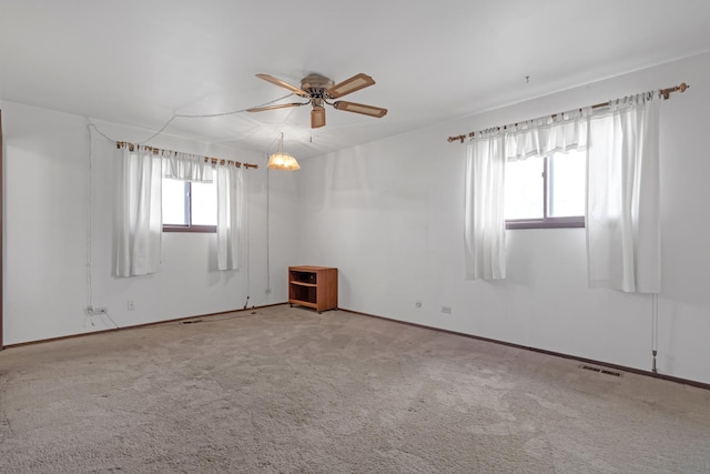 carpeted empty room with ceiling fan