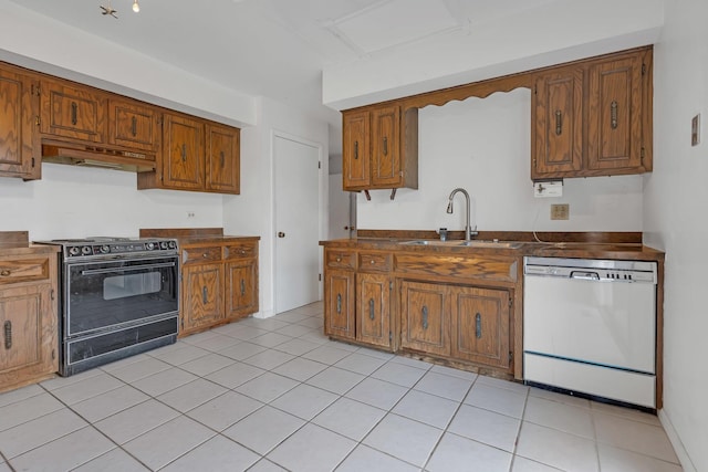 kitchen featuring black / electric stove, white dishwasher, sink, and light tile patterned floors