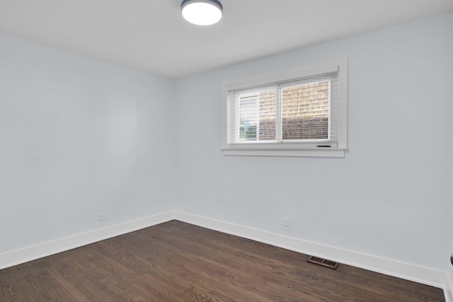 unfurnished room featuring dark hardwood / wood-style floors