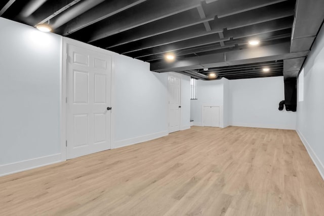 basement featuring light hardwood / wood-style floors