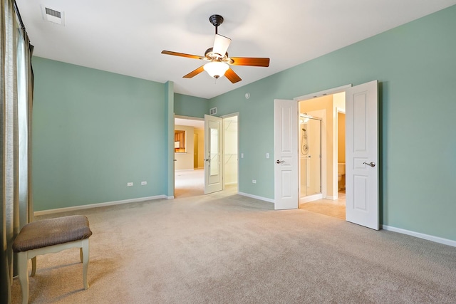 unfurnished bedroom featuring ceiling fan and light colored carpet