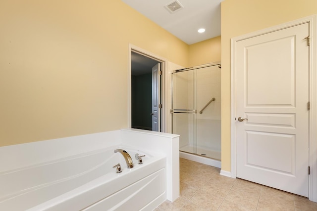 bathroom with independent shower and bath and tile patterned floors