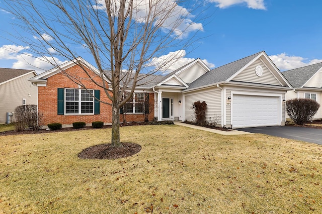 view of front of house featuring a garage and a front yard