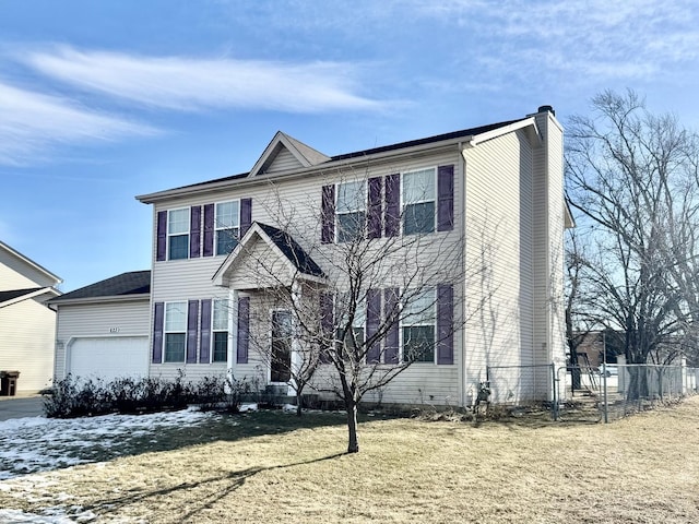 view of front of home featuring a garage and a front yard