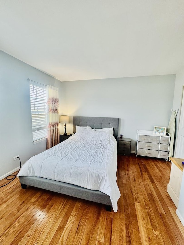 bedroom with hardwood / wood-style flooring