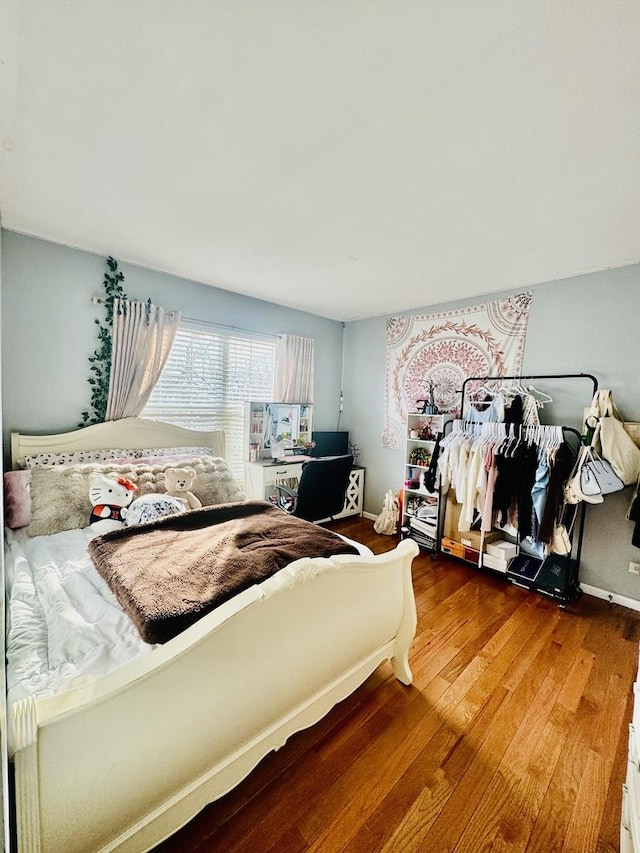 bedroom featuring wood-type flooring