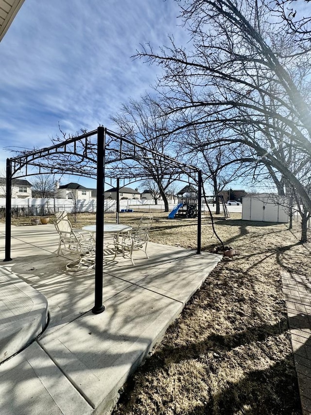 view of patio with a playground