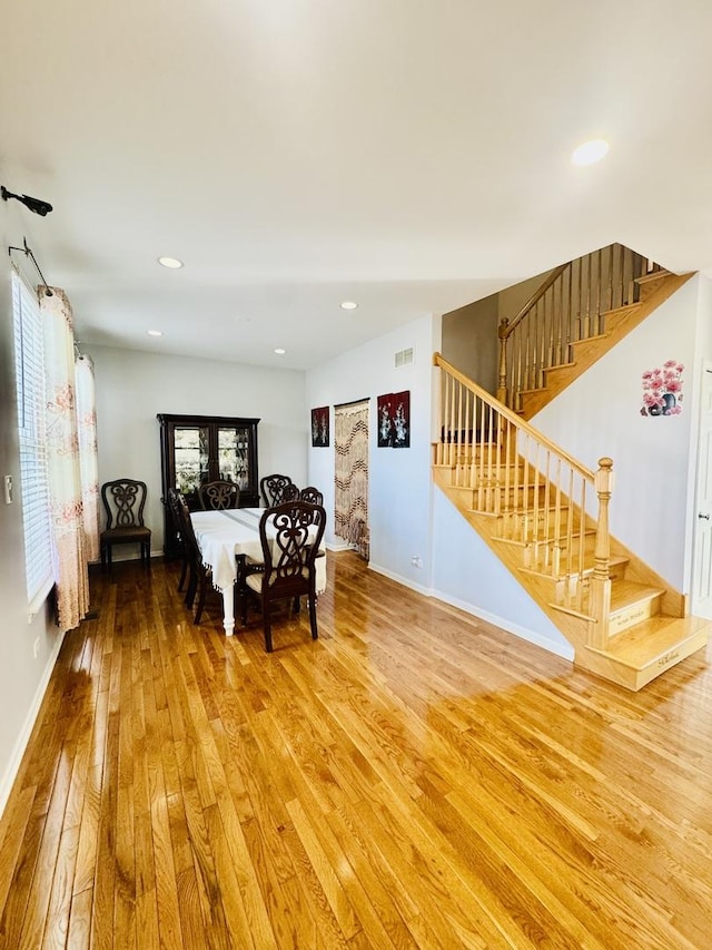 dining area with hardwood / wood-style flooring