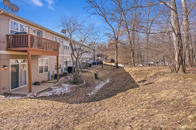 view of yard with a patio area and a balcony