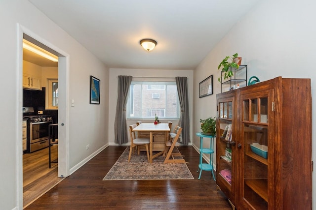 dining space featuring dark wood-type flooring