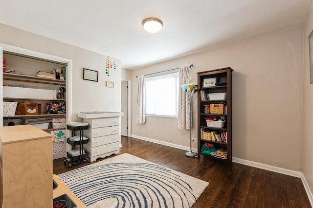 office with dark hardwood / wood-style floors