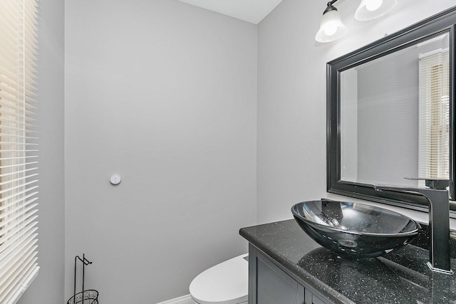 bathroom with vanity and toilet