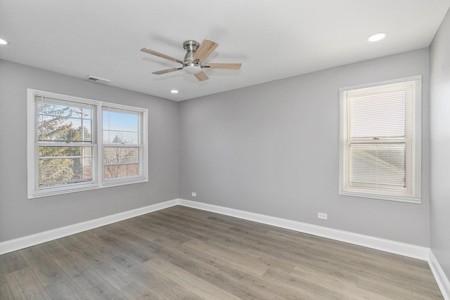 empty room featuring hardwood / wood-style flooring and ceiling fan