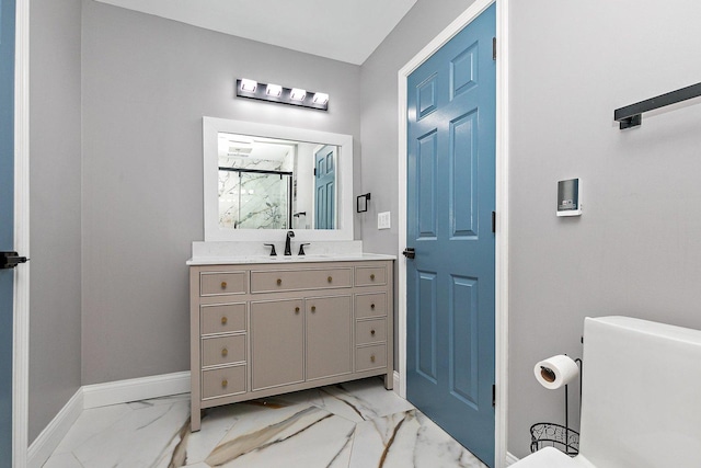 bathroom with vanity and a shower with shower door