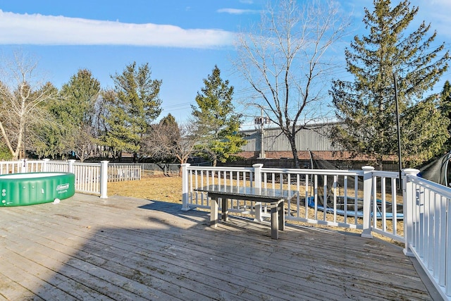 deck featuring a pool