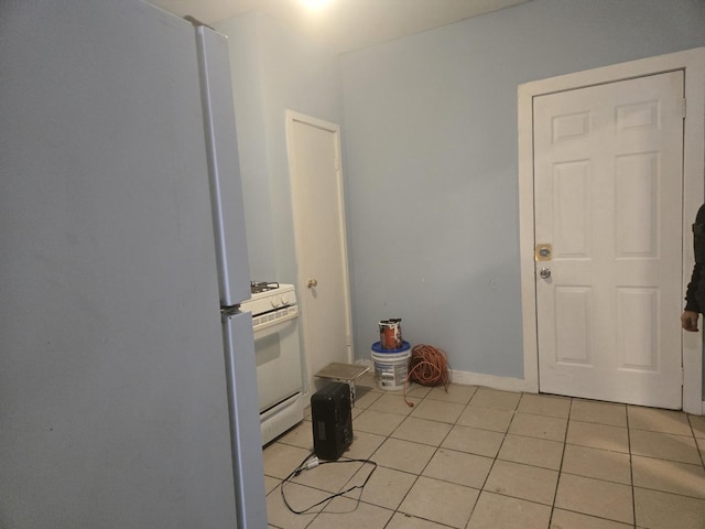 laundry room with light tile patterned floors