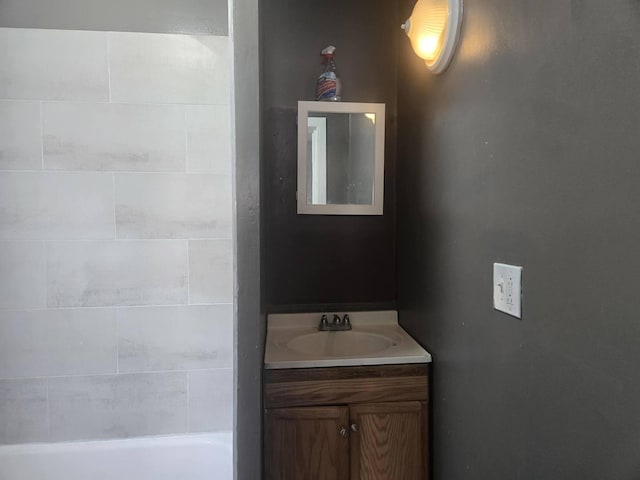 bathroom with vanity and a tub to relax in