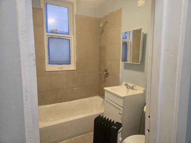 bathroom with vanity and tiled shower / bath combo