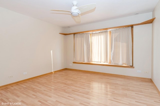 unfurnished room with light hardwood / wood-style flooring and ceiling fan