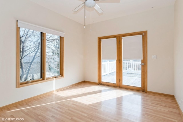 empty room with light hardwood / wood-style floors and ceiling fan