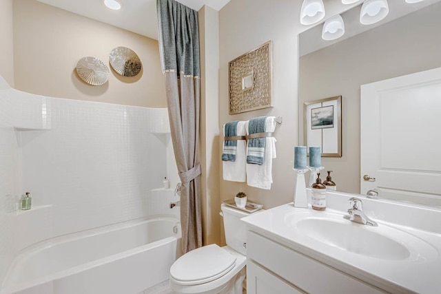 full bathroom with vanity, toilet, and shower / bath combo with shower curtain