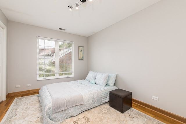 bedroom featuring hardwood / wood-style flooring