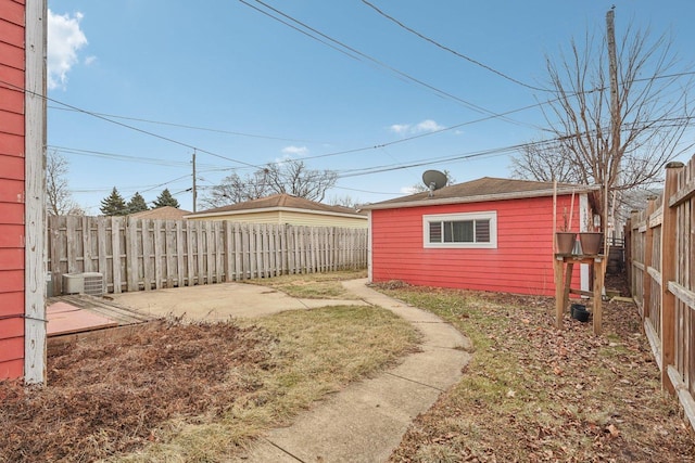 view of yard with central AC unit