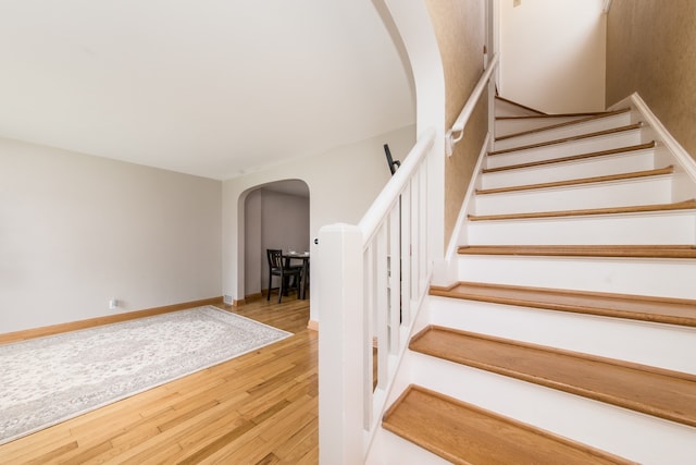 staircase featuring hardwood / wood-style floors