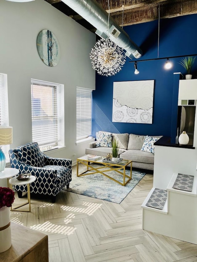 living room featuring a high ceiling and visible vents