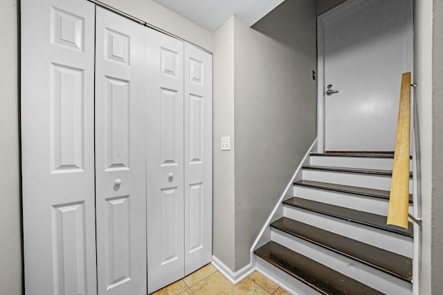 stairs with tile patterned floors