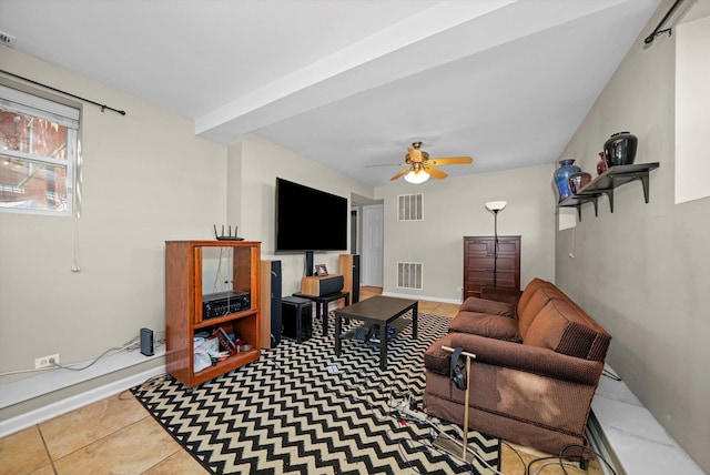 tiled living room with ceiling fan