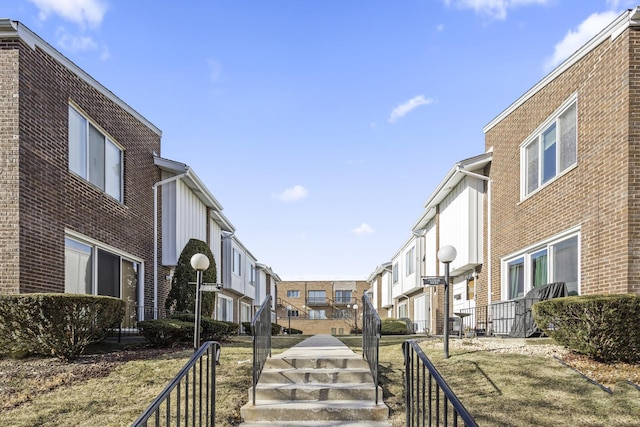 view of property's community featuring a yard