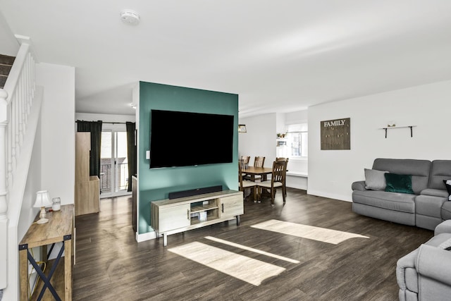 living room with dark hardwood / wood-style floors