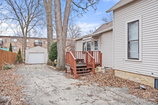 exterior space with an outbuilding and a garage