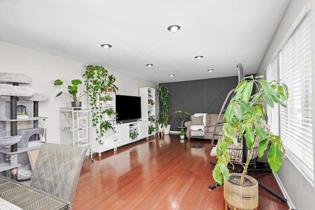 living room featuring a healthy amount of sunlight and hardwood / wood-style floors