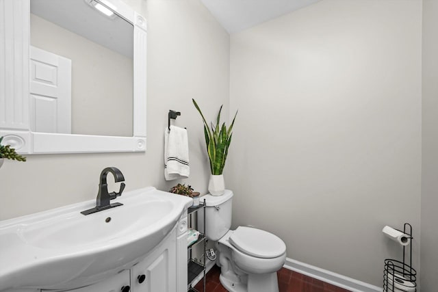 bathroom featuring vanity, hardwood / wood-style floors, and toilet