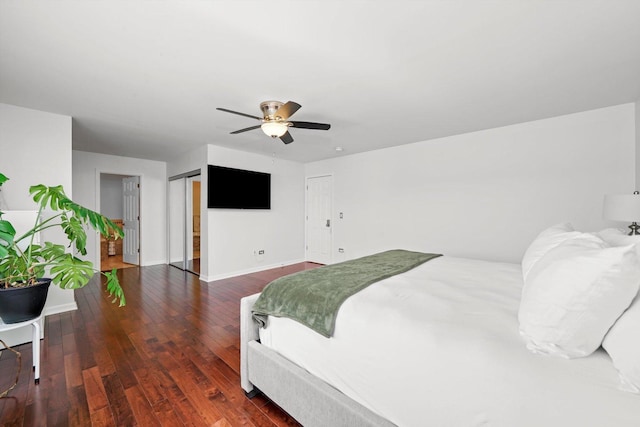 bedroom featuring dark hardwood / wood-style floors and ceiling fan