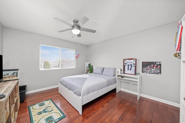 bedroom with ceiling fan and dark hardwood / wood-style floors