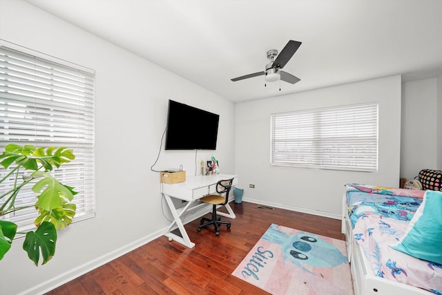 office area with dark hardwood / wood-style flooring and ceiling fan