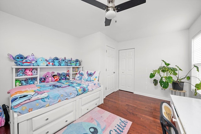 bedroom featuring dark hardwood / wood-style floors and ceiling fan