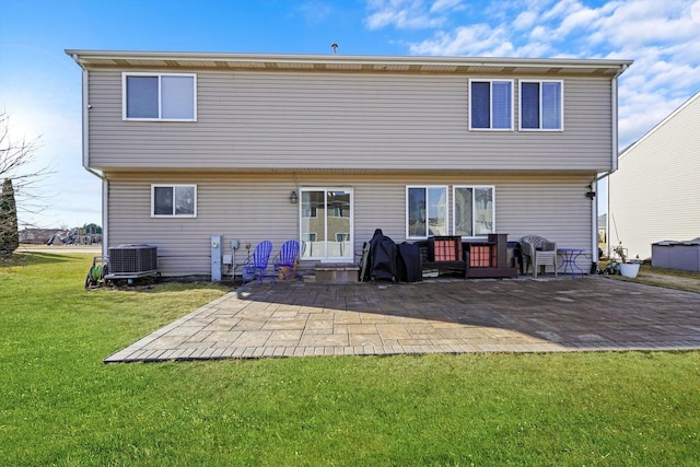 back of house with a yard, a patio area, and central AC