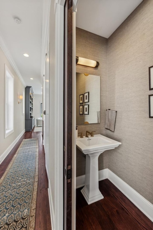 bathroom featuring hardwood / wood-style flooring and ornamental molding