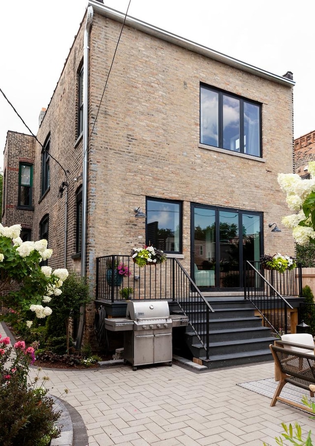 back of house with a patio