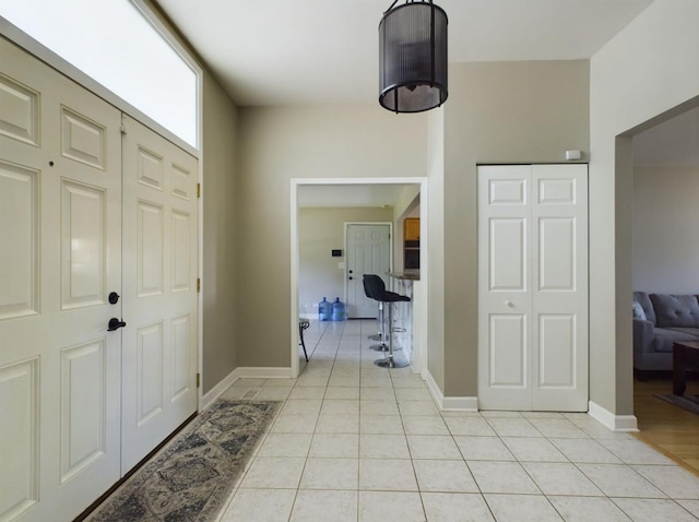 entrance foyer with light tile patterned flooring