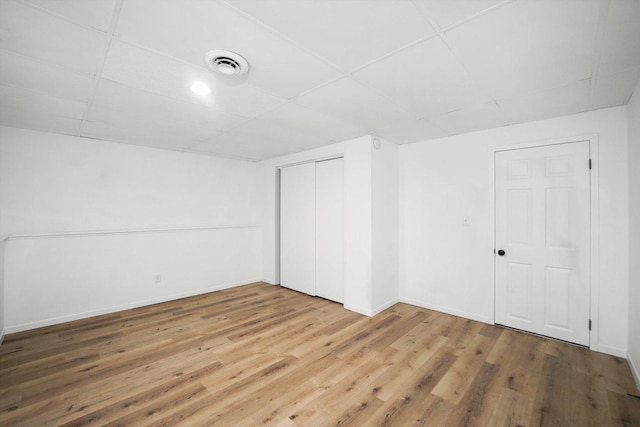 additional living space with wood-type flooring