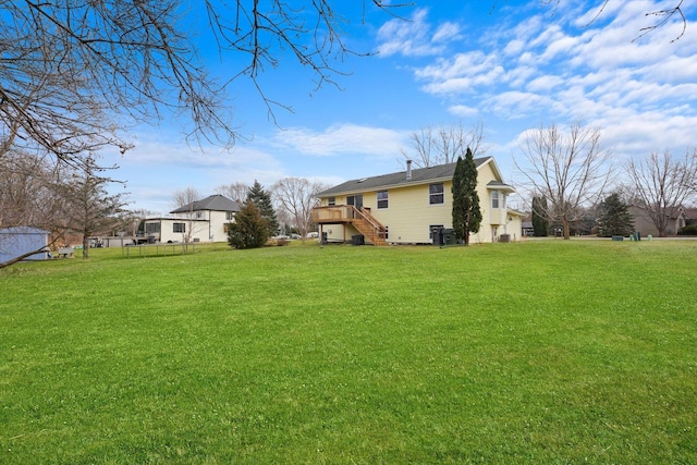 view of yard with a wooden deck