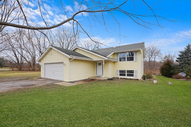 view of front of property featuring a garage and a front lawn